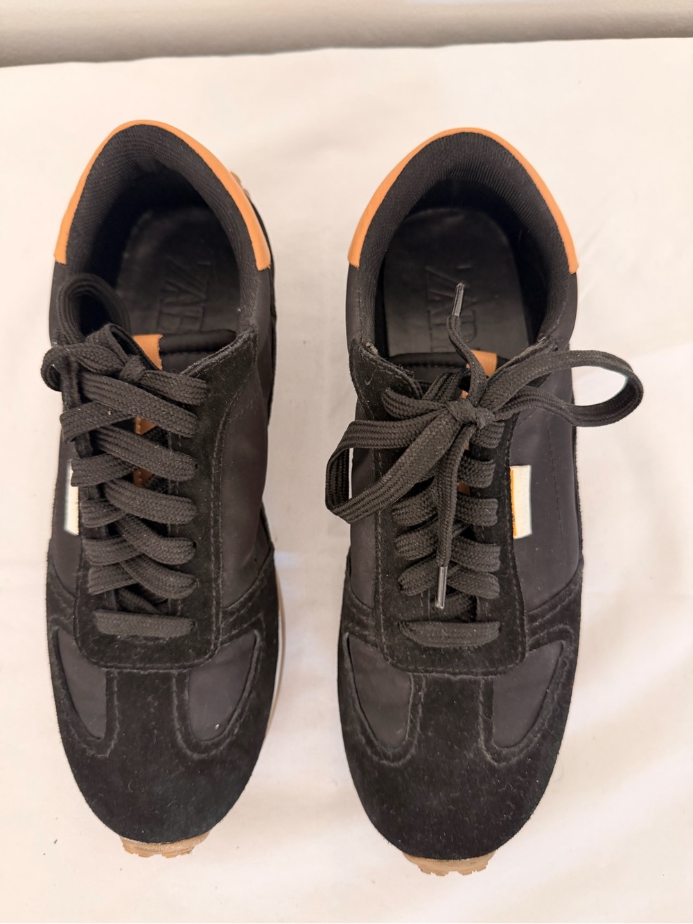 Zara Black Sneakers with Tan Heel Trim